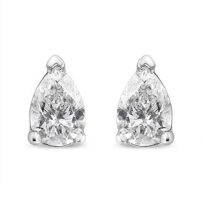 Front view of a pair of white metal pear shape stud earrings with white gemstones in 3-prong settings.