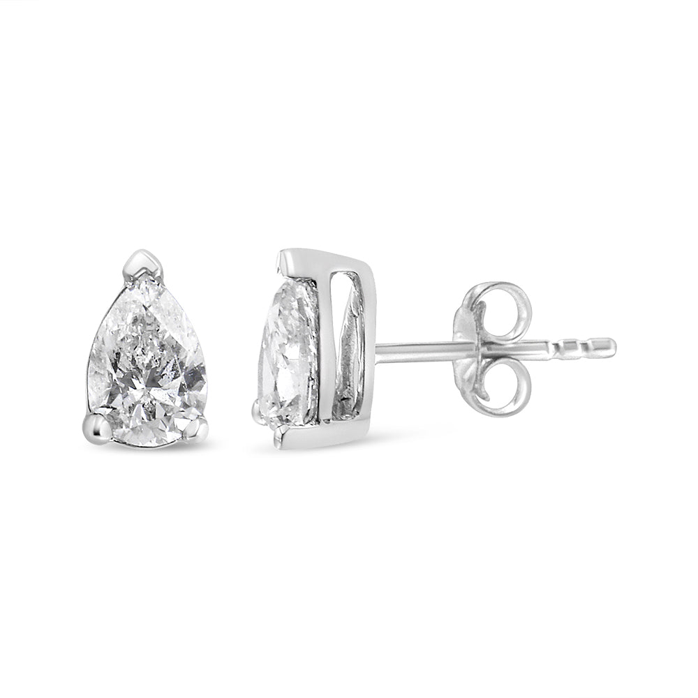 Front and side view of white metal stud earrings with pear-shaped white gemstones in 3-prong settings, shown against a white background.