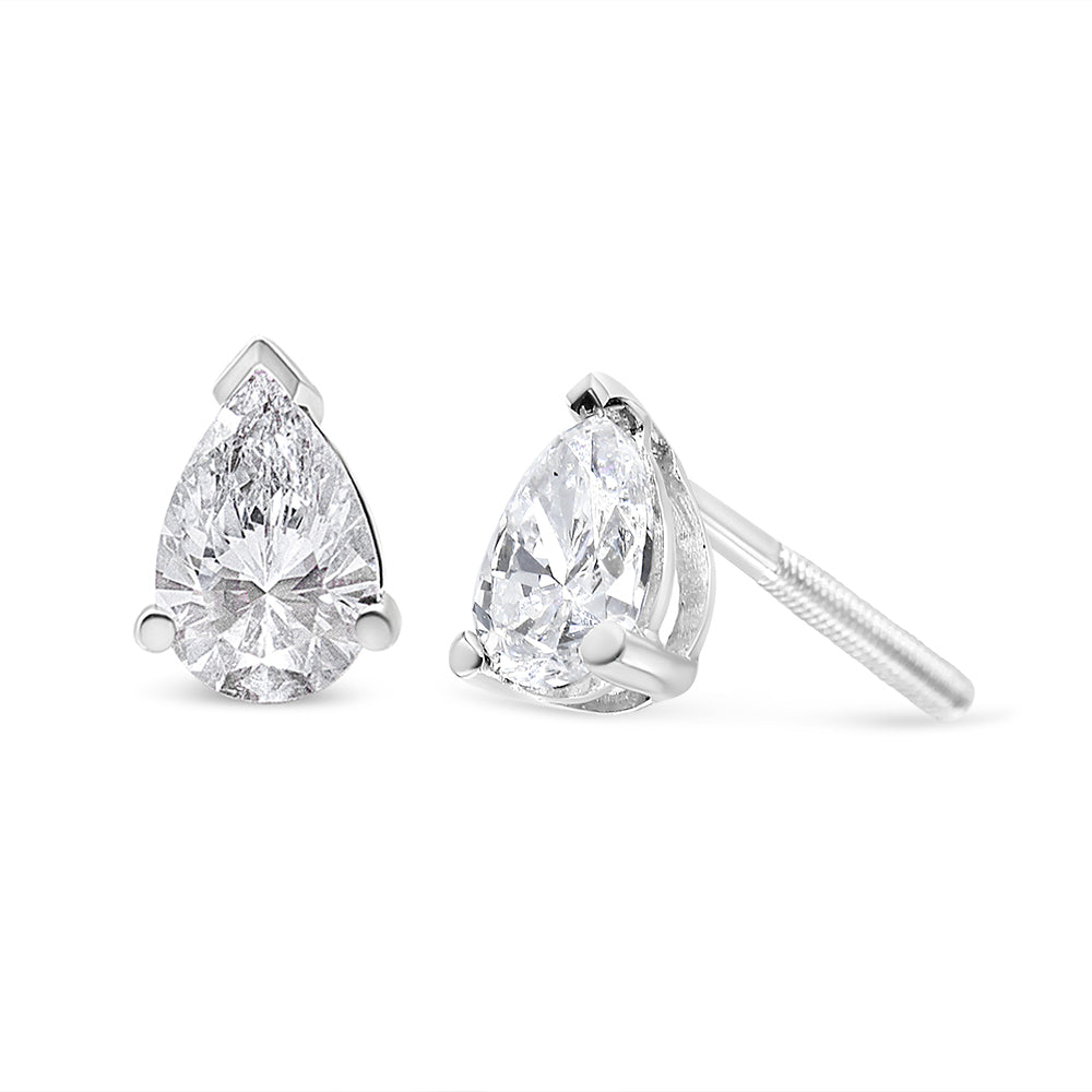 Pair of white metal earrings with pear-shaped white gemstones in 3-prong settings, shown from a front and side angle on a white background.