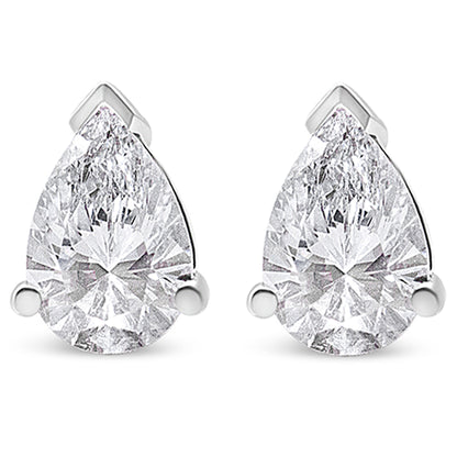 Front view of a pair of white metal earrings each featuring a pear-shaped white gemstone in a three-prong setting.