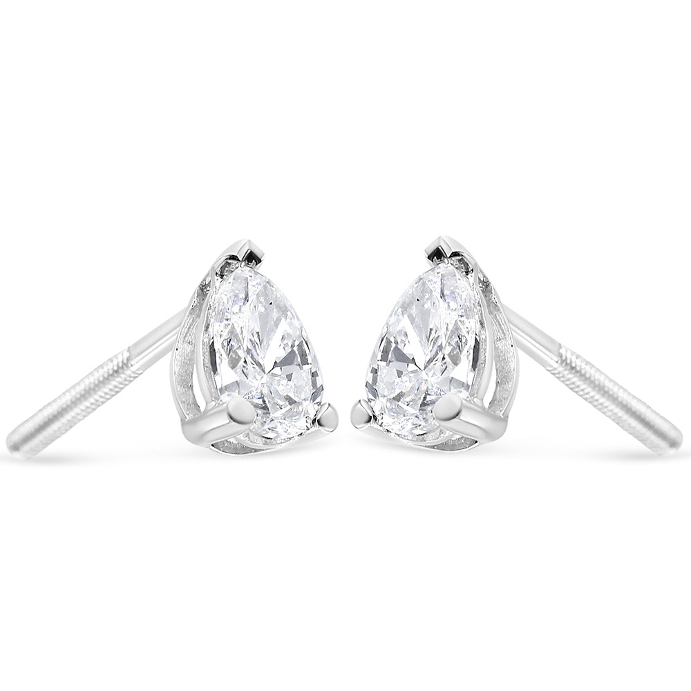 Pair of white metal earrings with pear-shaped white gemstones in a three-prong setting, shown from the front angle.