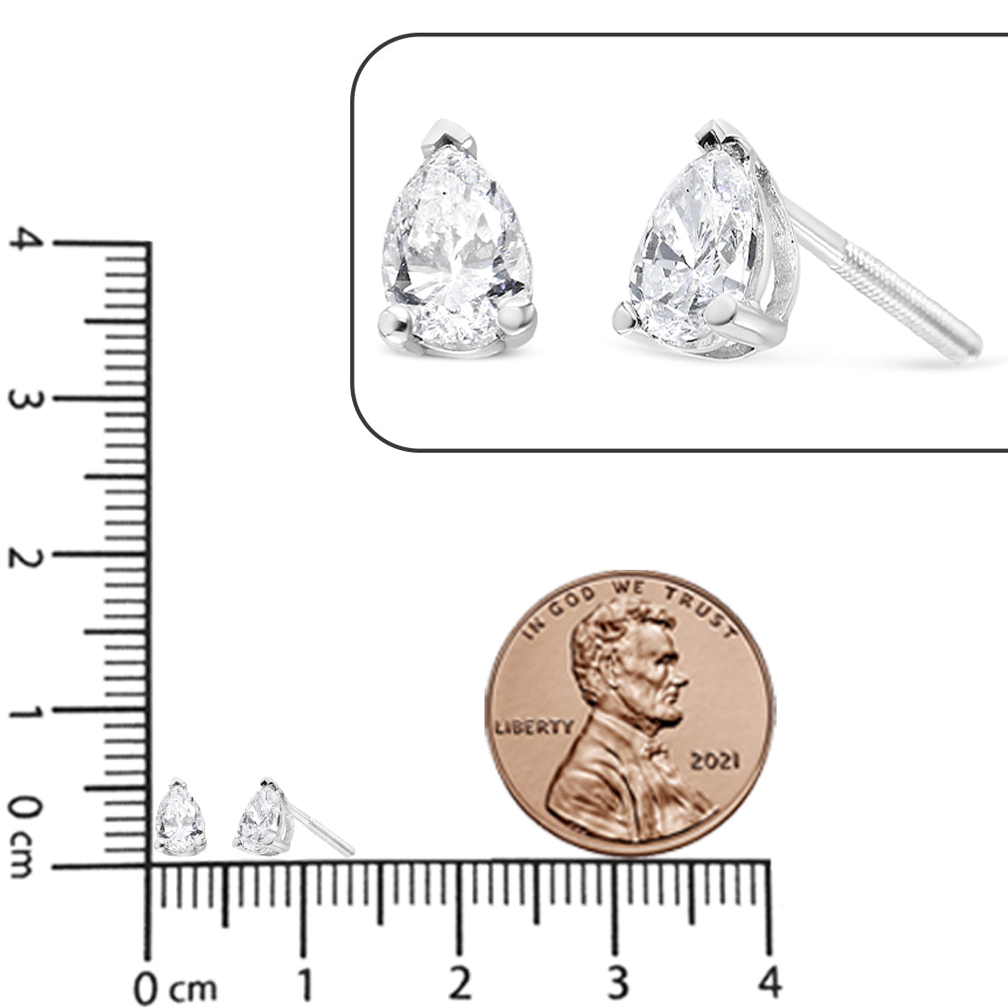 Pair of white metal earrings with pear-shaped white gemstones in 3-prong settings, shown on a ruler and close-up inset at an angle.