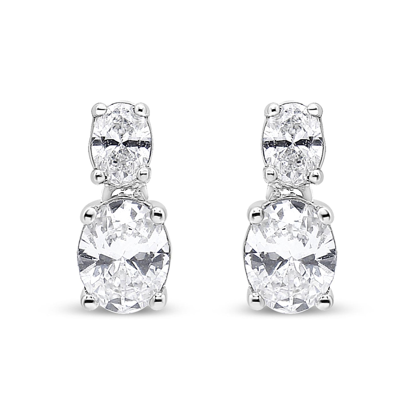 Front-facing view of white metal drop earrings featuring two oval-shaped white gemstones in four-prong settings, stacked vertically.