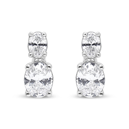 Front-facing view of white metal drop earrings featuring two oval-shaped white gemstones in four-prong settings, stacked vertically.