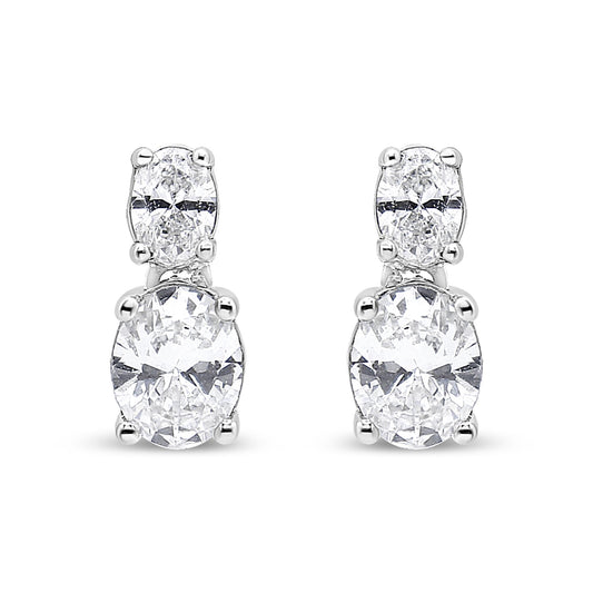 Front-facing view of white metal drop earrings featuring two oval-shaped white gemstones in four-prong settings, stacked vertically.