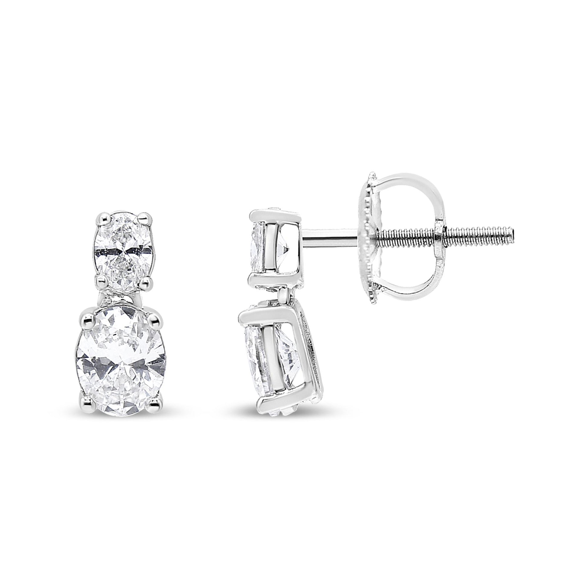 Front and side view of white metal earrings featuring two oval-shaped white gemstones in four-prong settings.