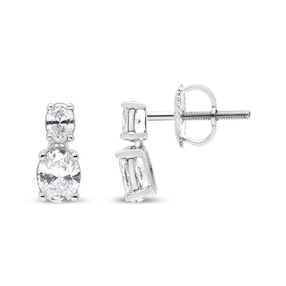 Front and side view of white metal earrings featuring two oval-shaped white gemstones in four-prong settings.