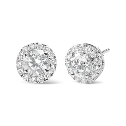 Pair of white metal round stud earrings with a large central white gemstone surrounded by smaller white gemstones, shown from a front and side angle on a white background.