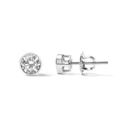 Pair of white metal stud earrings with round white gemstones in bezel settings, one viewed from the front and one from the side on a white background.