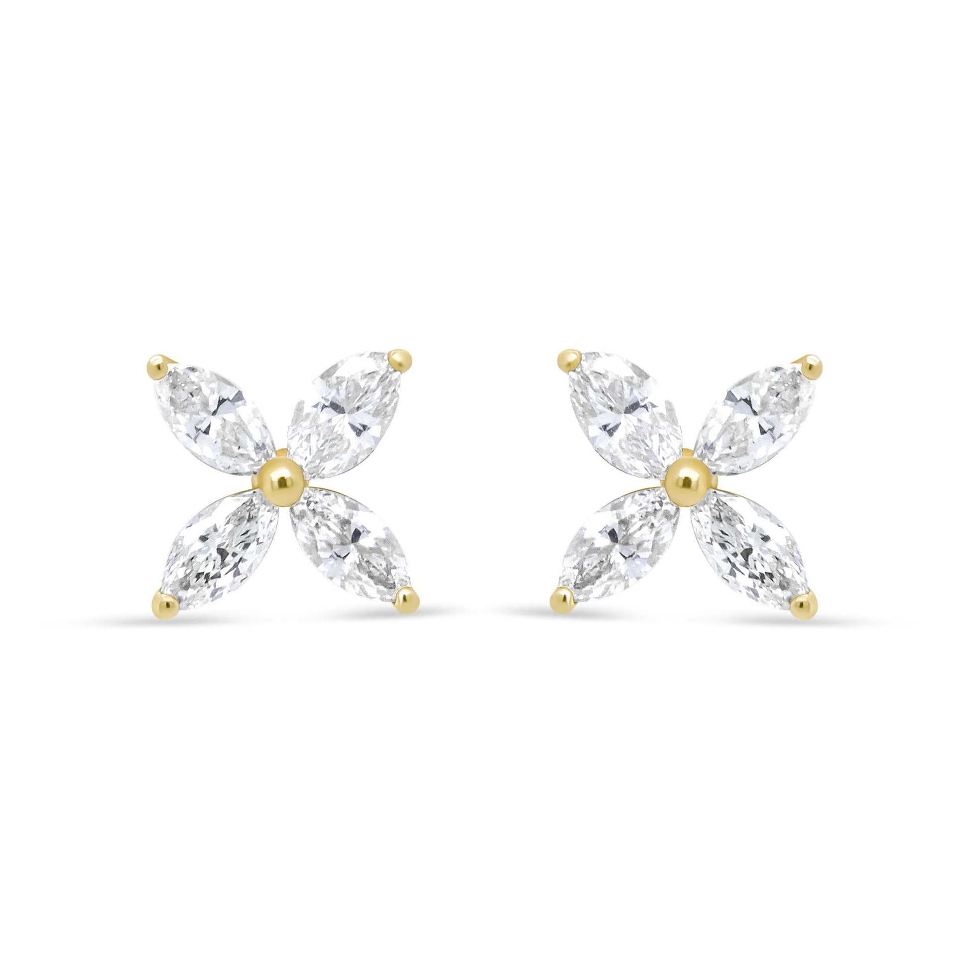 Front view of yellow metal earrings with four marquise-shaped white gemstones arranged in a floral pattern.