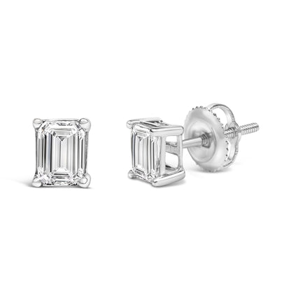 Pair of white metal stud earrings with emerald-shaped white gemstones in 4-prong settings, shown from front and side angles.