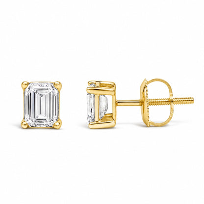 Close-up image showing a pair of yellow metal stud earrings with emerald-shaped white gemstones in a 4-prong setting, presented from the front and side angles on a white background.