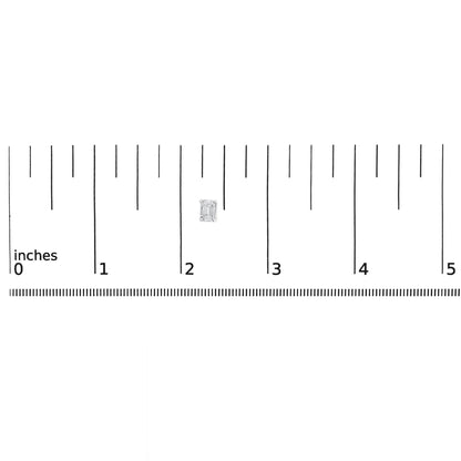 Top-down view of white metal emerald-shaped earring with two white gemstones in 4-prong setting, placed on a ruler for size reference.