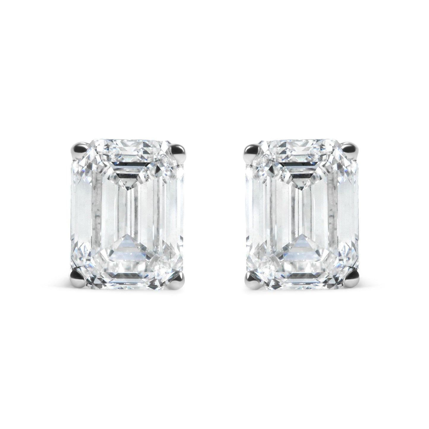 Pair of white metal earrings with emerald shaped white gemstones in 4-prong settings, front facing shot on white background.