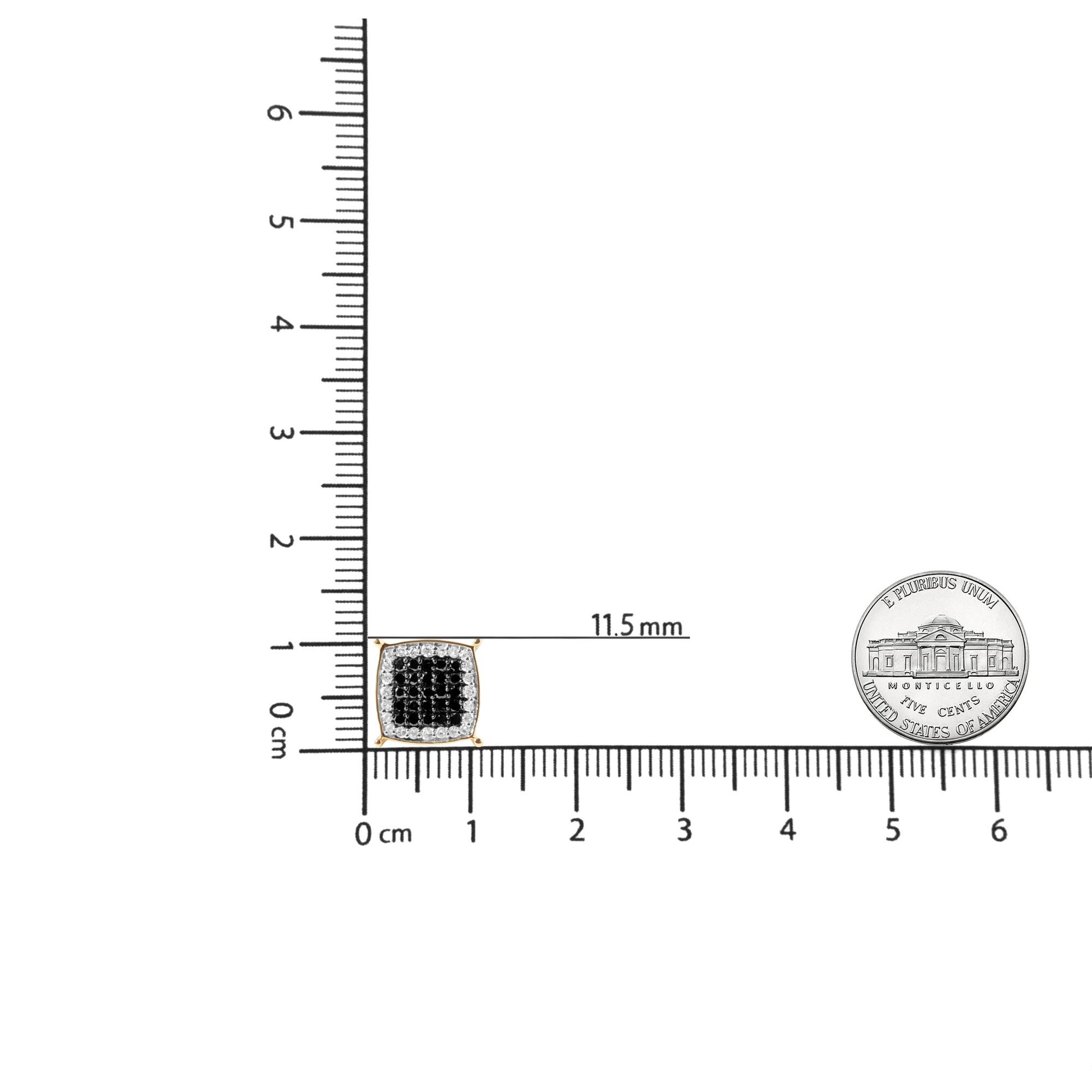 Close-up image of one square-shaped yellow metal earring with a cluster of black gemstones in the center, surrounded by a border of white gemstones, displayed on a ruler for size reference.