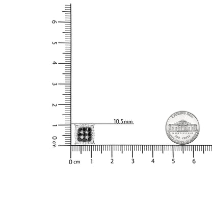 Square yellow metal stud earring with black and white gemstones in prong settings, shown on a ruler for size reference, front view.