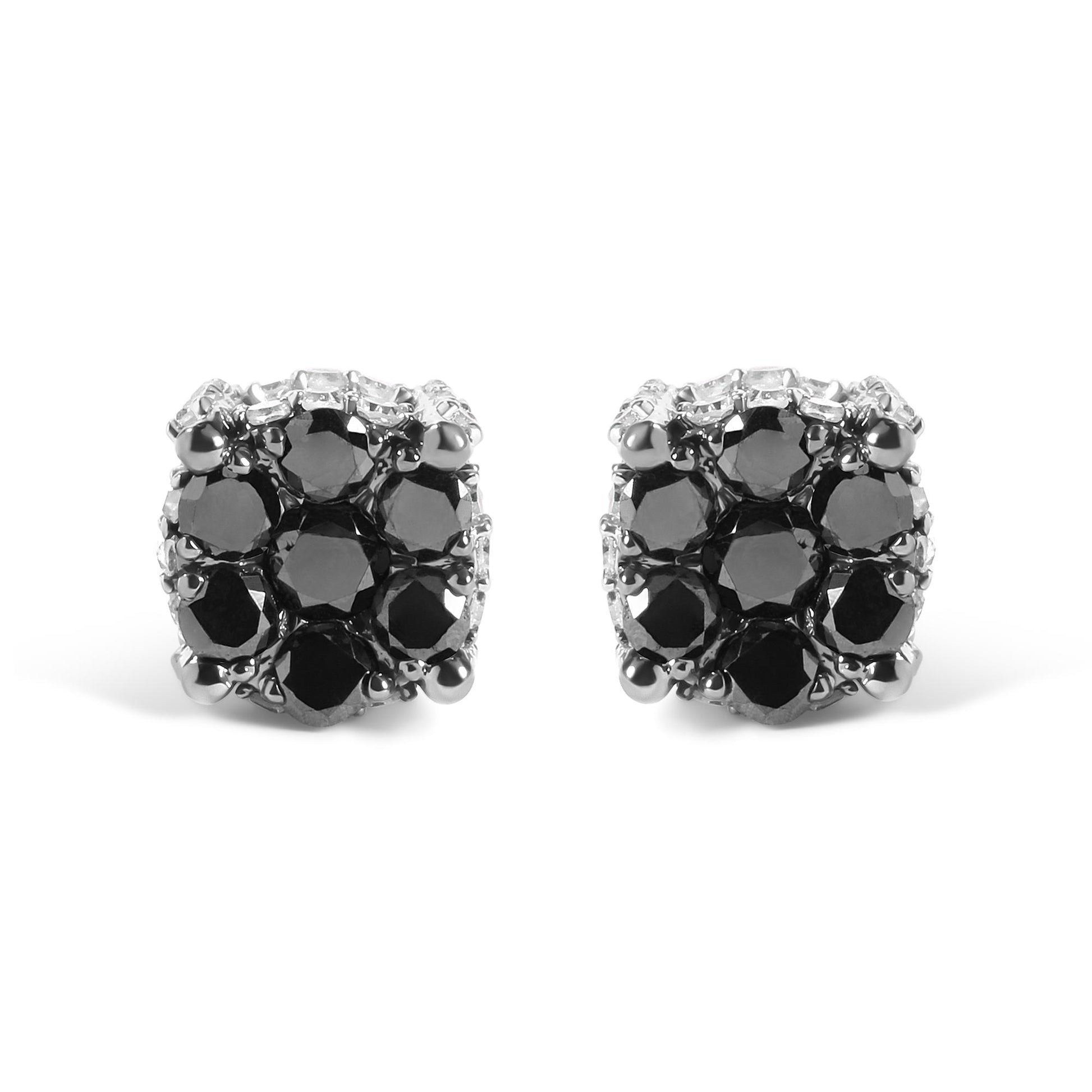 Front-facing close-up of yellow metal earrings featuring round black and white gemstones in prong settings.