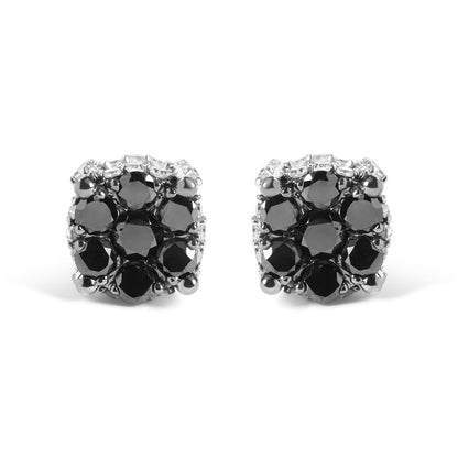 Front-facing close-up of yellow metal earrings featuring round black and white gemstones in prong settings.