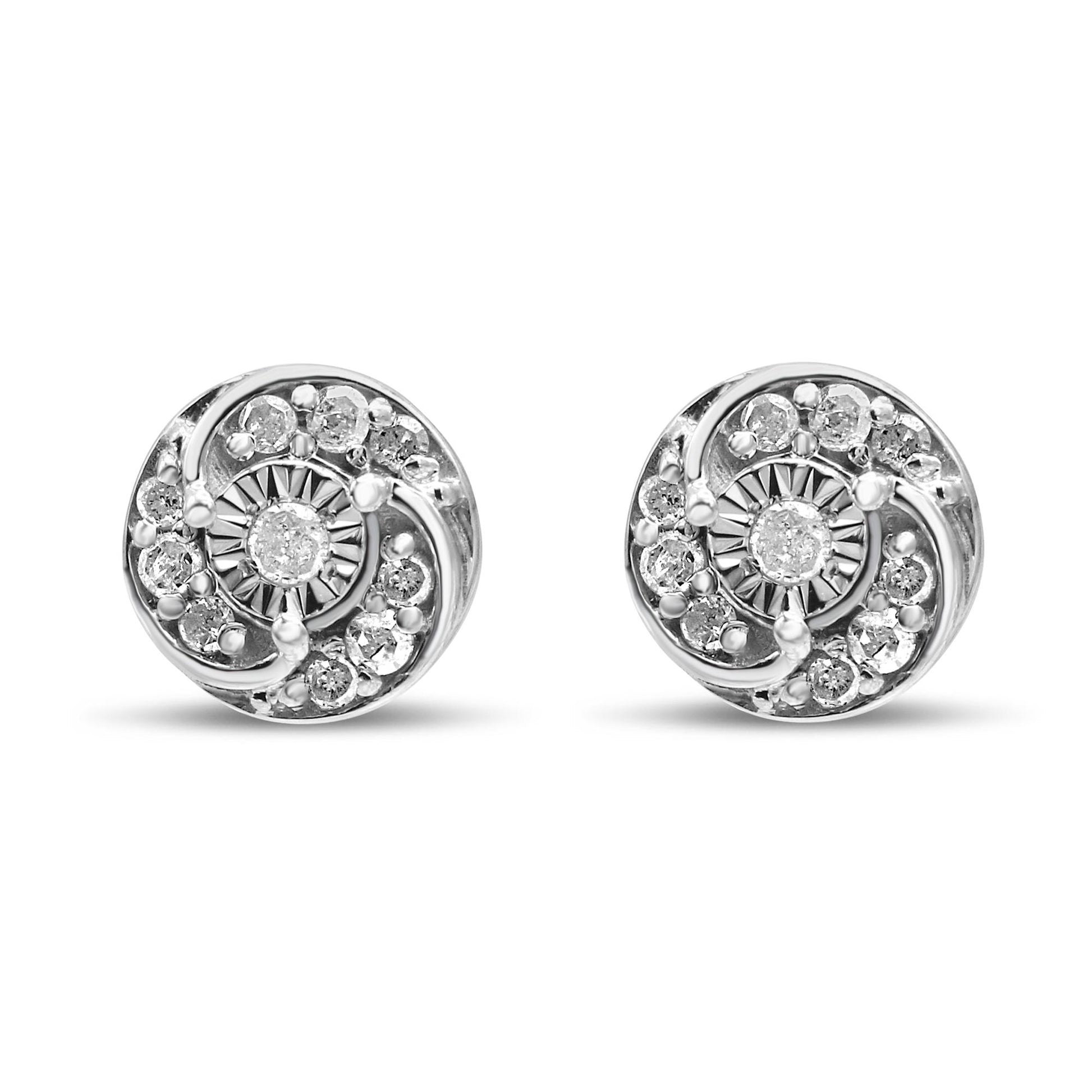 Front view of a pair of white metal round earrings with prong-set white gemstones arranged in a swirl pattern.