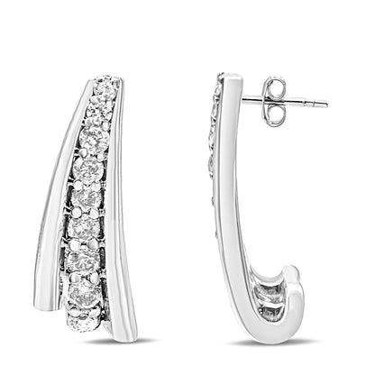 Pair of white metal earrings with curved design and prong-set round white gemstones, front and side views at eye level.