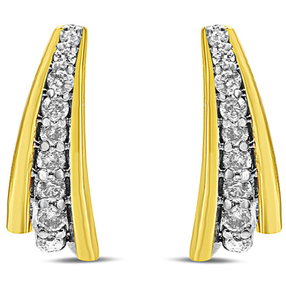 Pair of yellow metal earrings with a curved design, featuring a row of round white gemstones in prong settings, shown from the front angle.