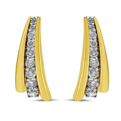Pair of yellow metal earrings with a curved design featuring a row of round white gemstones in prong settings, shown from the front angle.
