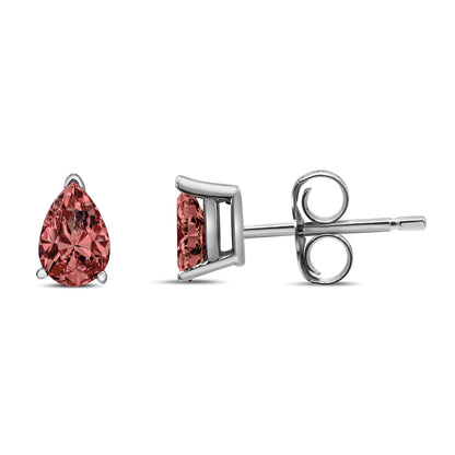 White metal stud earrings with pear-shaped pink gemstones in 3-prong settings, shown from front and side angles on a white background.