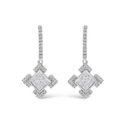 Pair of white metal earrings shown from the front on a white background, featuring elongated hoops adorned with round white gemstones in prong settings, and hanging pendants with large square centers composed of invisible-set princess-shaped white gemstones, surrounded by clusters of round white gemstones.