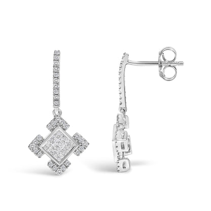 Close-up side and front angle of white metal earrings featuring a geometric pendant with princess-shaped white gemstones in an invisible setting surrounded by round white gemstones in prong settings.
