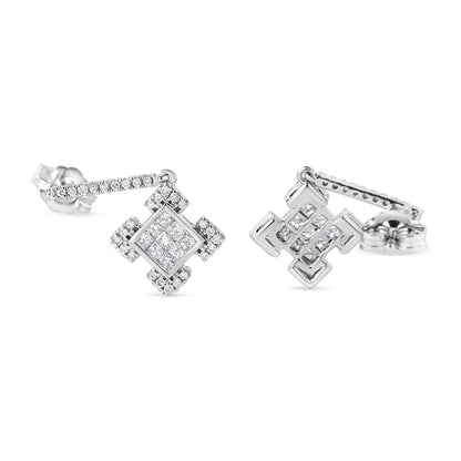 Close-up front angle view of a pair of white metal stud earrings featuring square shapes with invisible-set princess white gemstones surrounded by round white gemstones in 4-prong settings. The earrings are shown on a white background.