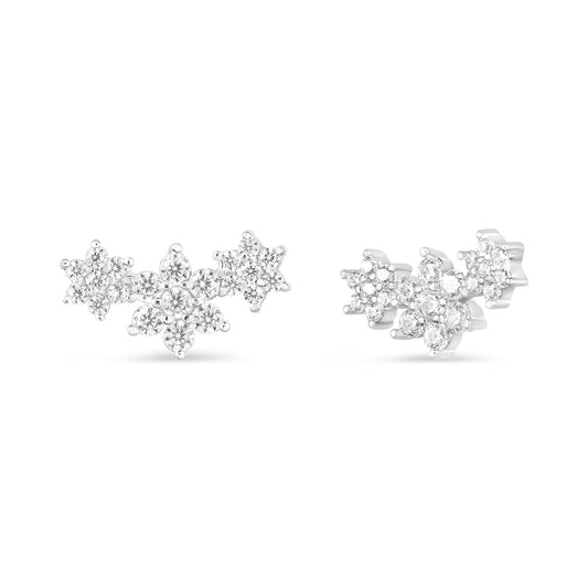 Front and side views of 10K white gold diamond triple snowflake cluster stud earrings on white background