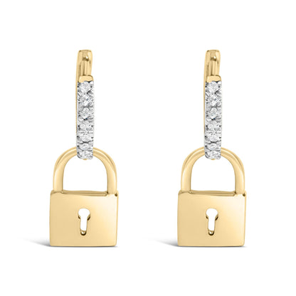 Front view of yellow metal lock-shaped earrings with upper sections featuring white round gemstones in prong settings.