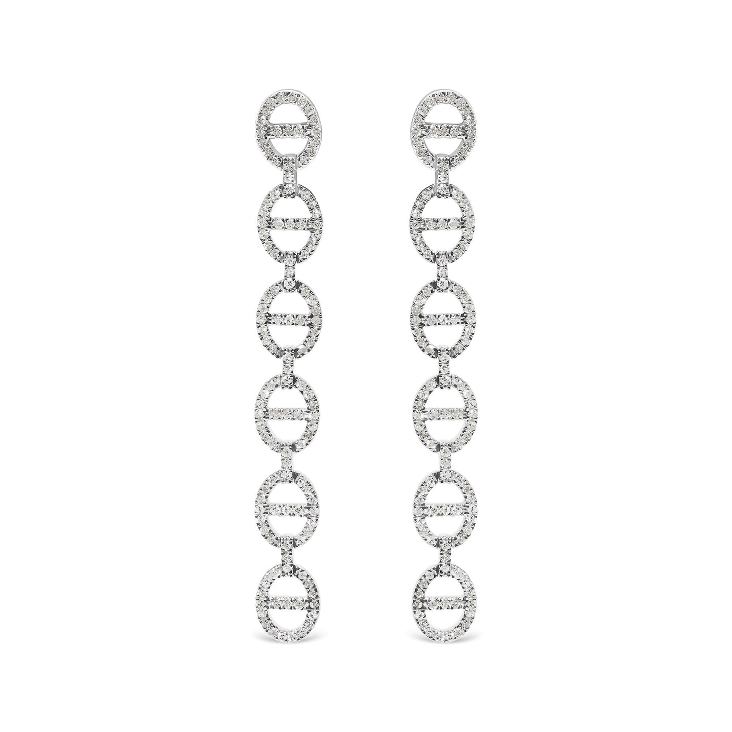 Front view of long white metal earrings composed of linked oval shapes set with round white gemstones in prong settings, shown on white background.
