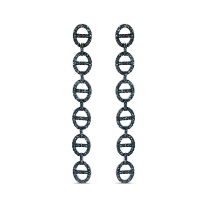 Front view of white metal drop earrings composed of linked oval shapes embellished with prong-set round blue gemstones, shown on a white background.