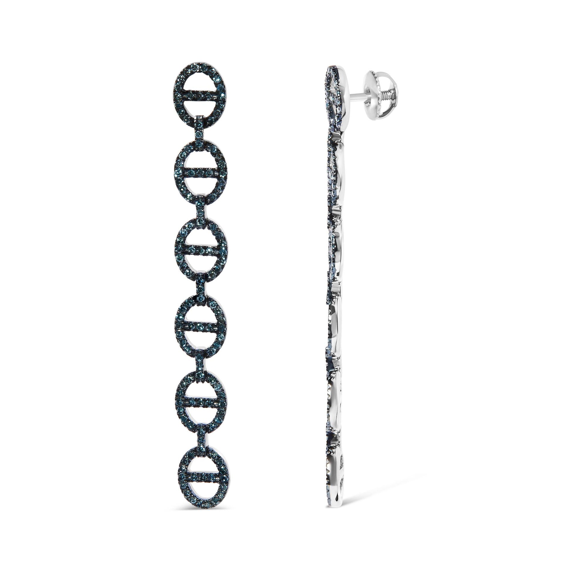 White metal long dangle earrings with linked oval shapes set with round prong-set blue gemstones, shown in a side-by-front angle.