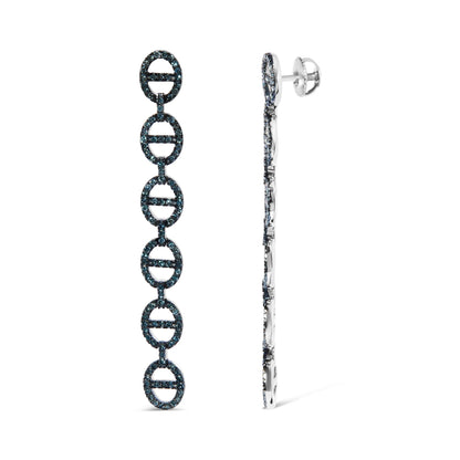 White metal long dangle earrings with linked oval shapes set with round prong-set blue gemstones, shown in a side-by-front angle.