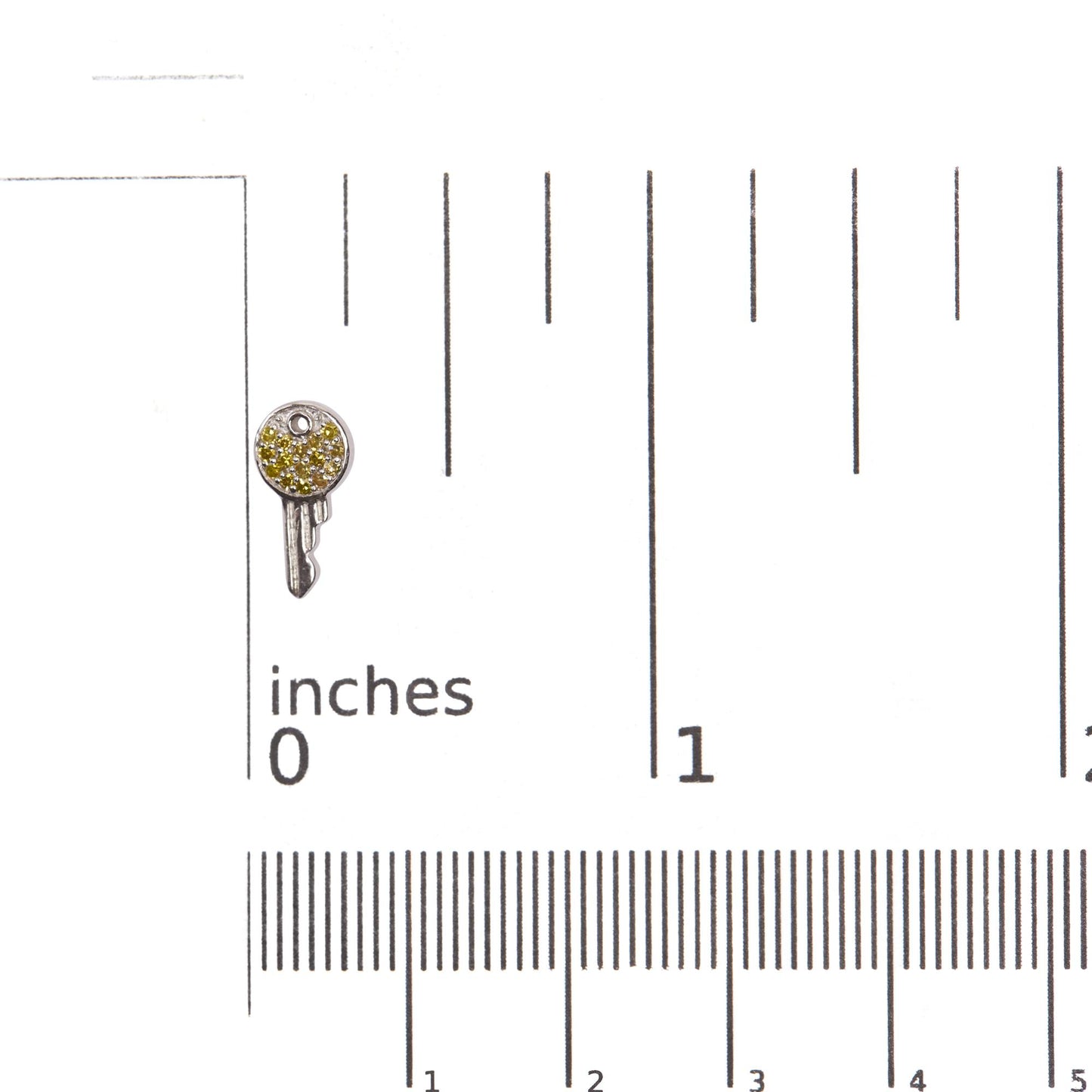 Close-up front angle of a white circular earring with prong-set round yellow gemstones, shown on a ruler scale.