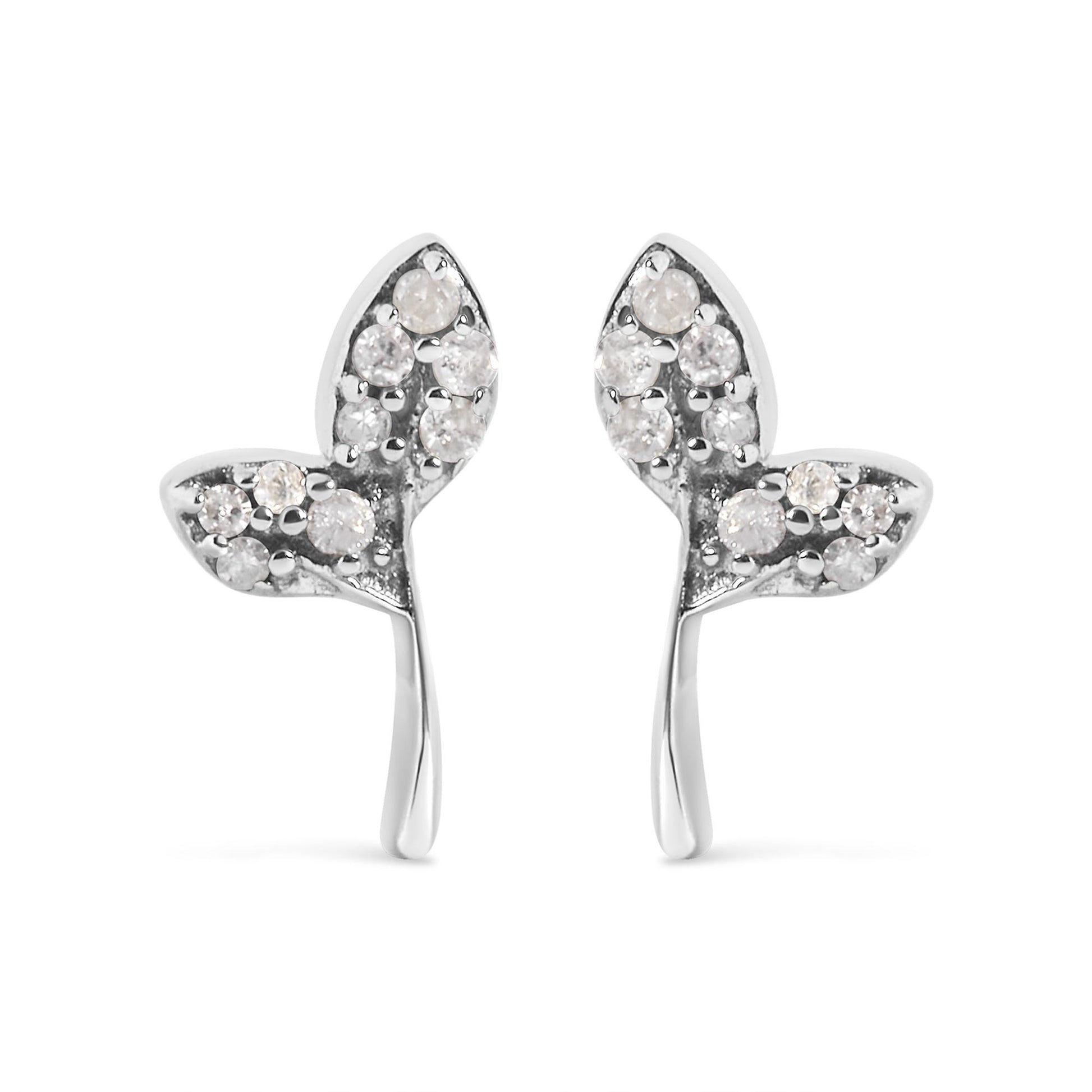 Front view of a pair of white metal earrings shaped like two connected hearts, each heart adorned with multiple round white gemstones in prong settings.