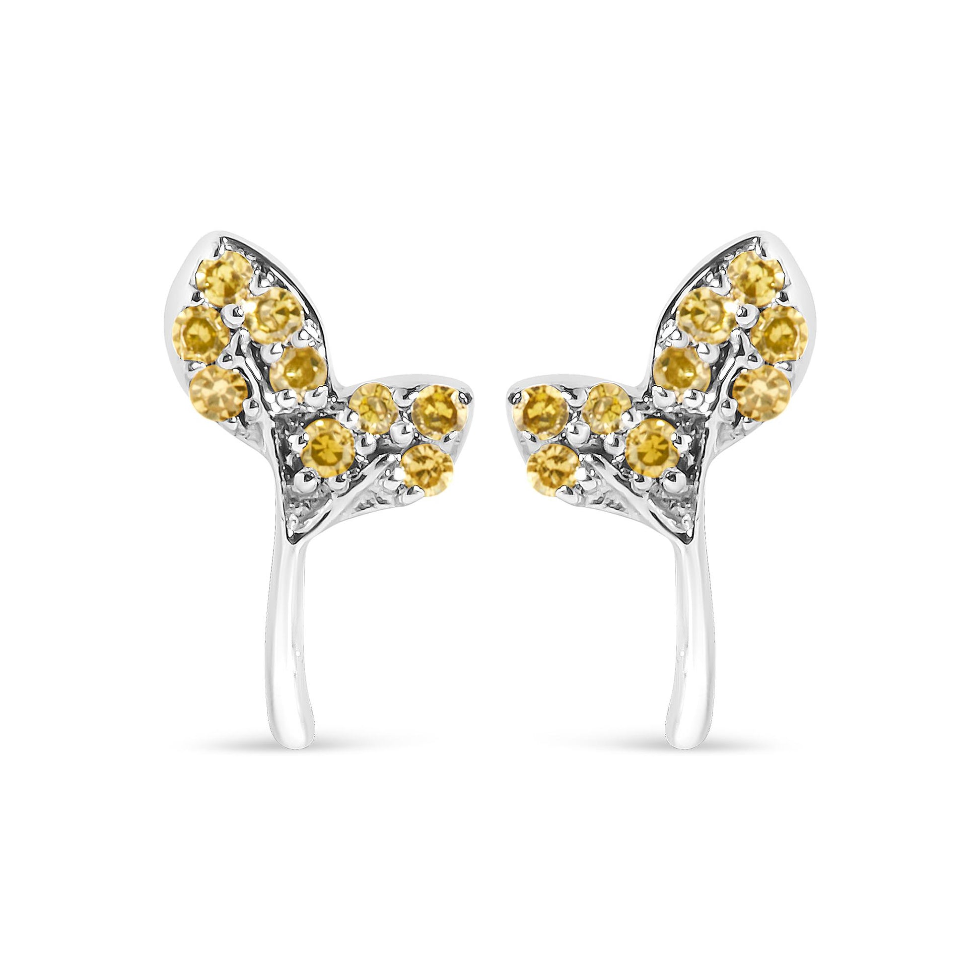 Close-up front view of white metal earrings adorned with multiple round yellow gemstones in prong settings, shown on a white background.