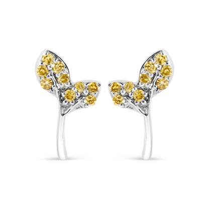 Close-up front view of white metal earrings adorned with multiple round yellow gemstones in prong settings, shown on a white background.