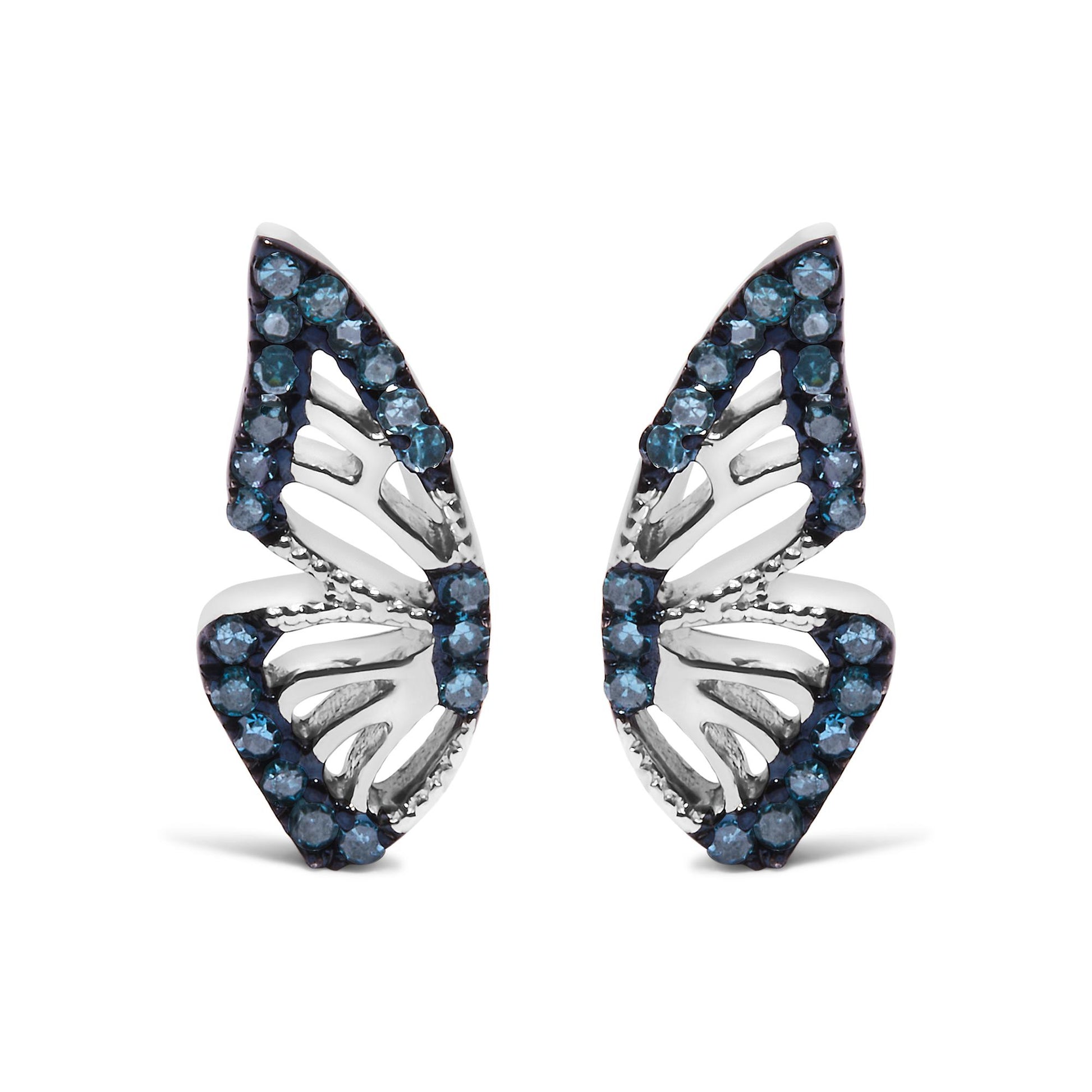 Close-up front view of a pair of white metal earrings with an openwork leaf design, accented with round blue gemstones in prong settings along the edges.