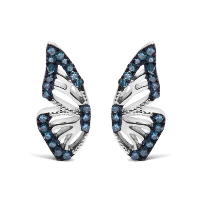 Close-up front view of a pair of white metal earrings with an openwork leaf design, accented with round blue gemstones in prong settings along the edges.