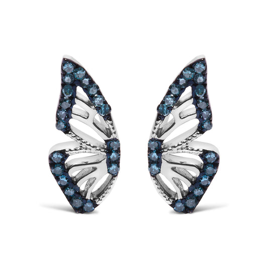 Close-up front view of a pair of white metal earrings with an openwork leaf design, accented with round blue gemstones in prong settings along the edges.