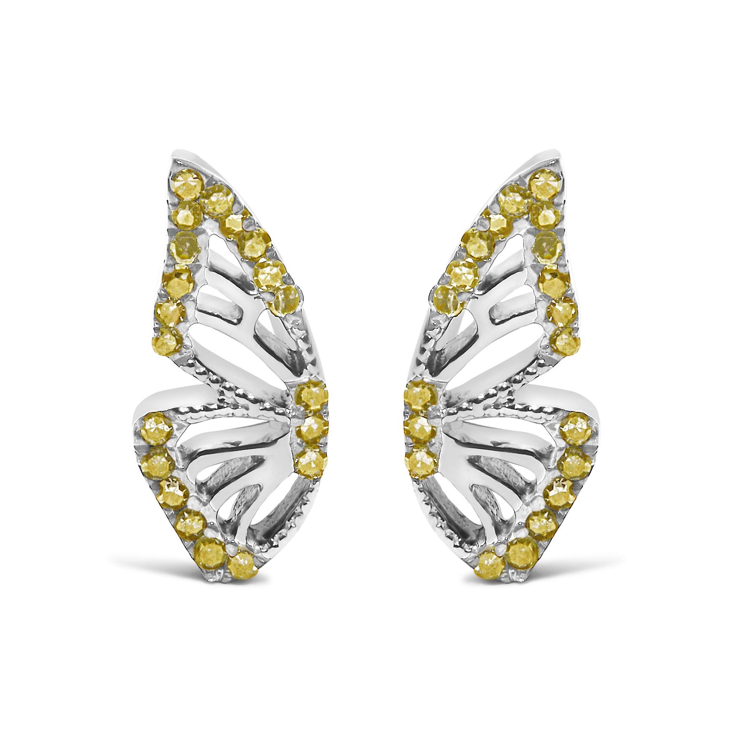Close-up front view of a pair of white metal earrings shaped like leaves with openwork design, accented around the edges with round yellow gemstones in prong settings, shown on a white background.