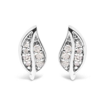 Front view of a pair of white metal earrings shaped like elongated leaves, each set with multiple round white gemstones in prong settings.