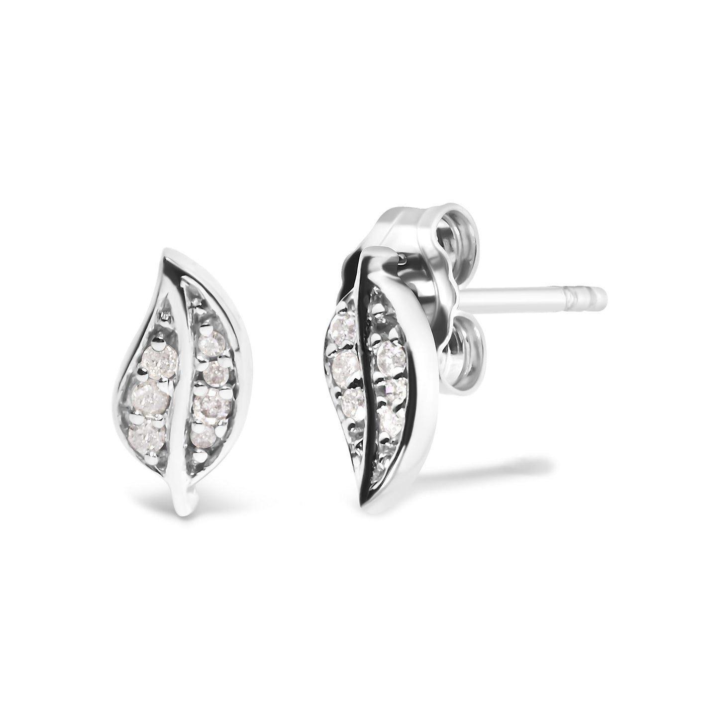 Pair of white metal earrings with a curved leaf shape, set with multiple round white gemstones in a prong setting, shown in a close-up angled side view.