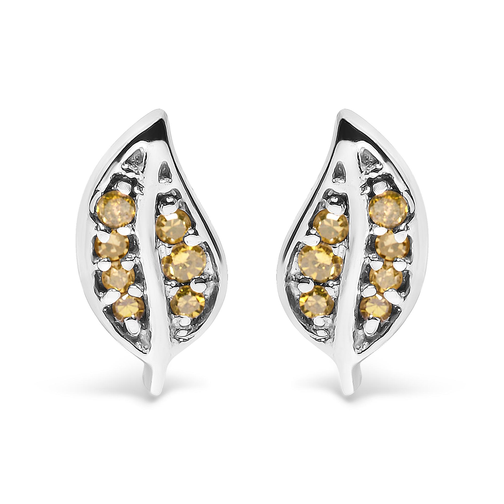 Front angle view of white metal leaf-shaped earrings with round prong-set yellow gemstones.