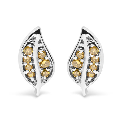 Front angle view of white metal leaf-shaped earrings with round prong-set yellow gemstones.