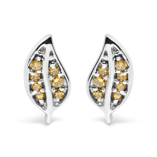 Front angle view of white metal leaf-shaped earrings with round prong-set yellow gemstones.