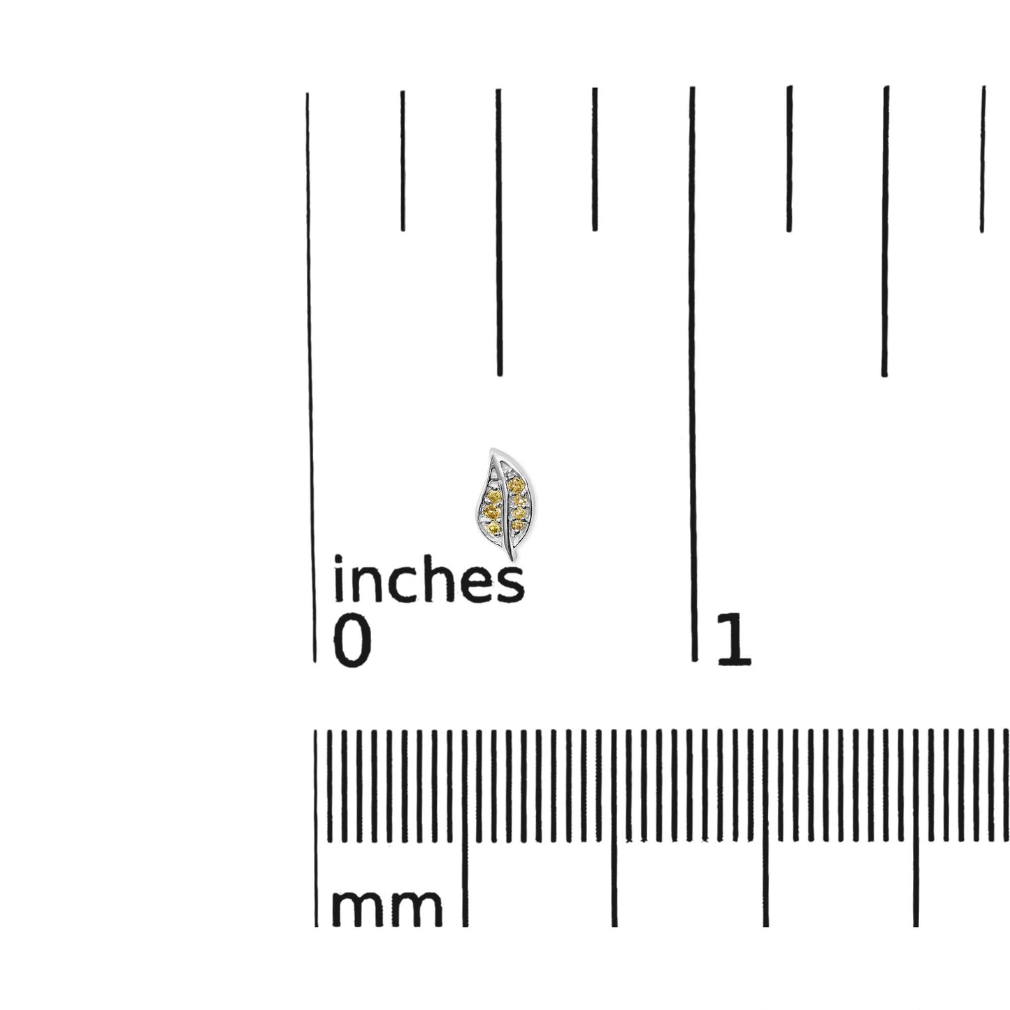 Close-up front view of a white metal leaf-shaped earring with multiple small round yellow gemstones in prong settings, placed on a ruler for size reference.